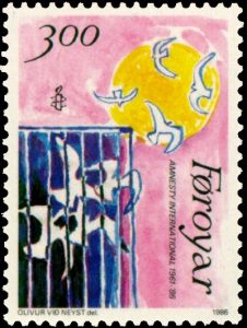 Amnesty International commemorative stamp, 1961-1986. Image via Wikimedia Commons.